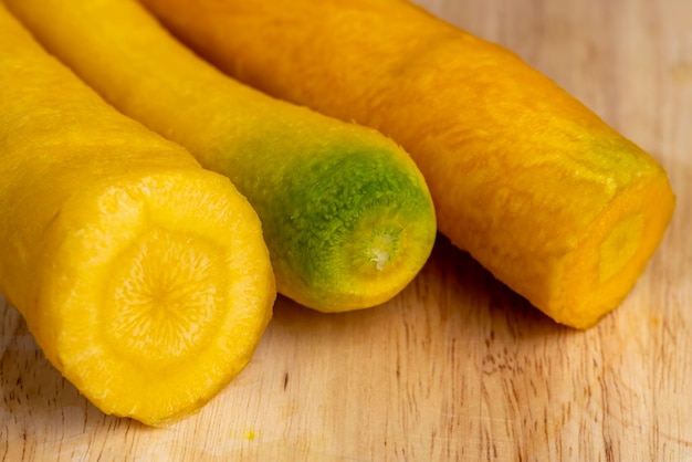 Pieces of sliced peeled carrots are yellow unusual yellow carrots are cut into pieces during cooking