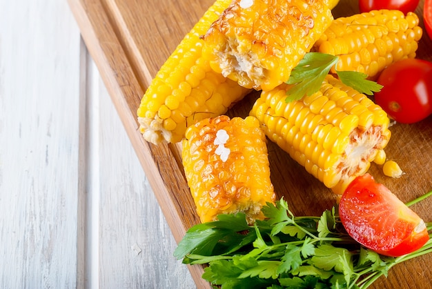 Pieces of sweet corn grilled in tin foil