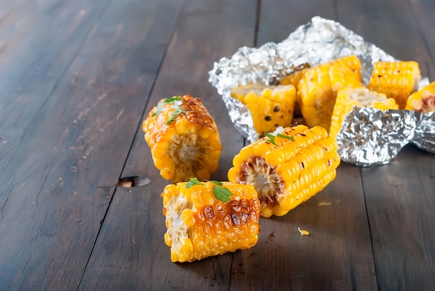 Pieces of sweet corn grilled in tin foil