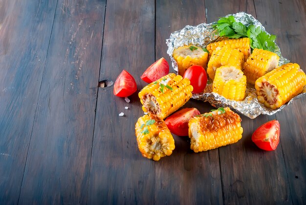 Pieces of sweet corn grilled in tin foil