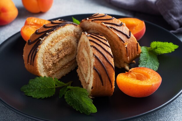 Pieces of sweet rolls with cream filling on a plate