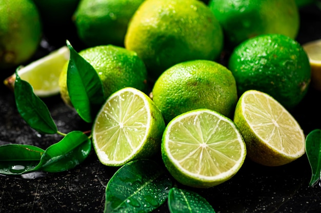 Pieces and whole lime with leaves
