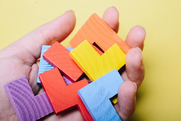 Pieces of wooden colorful puzzle as business strategy concept