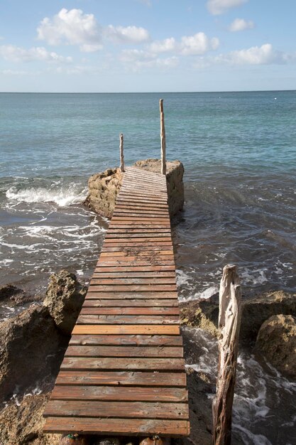 Pier at Cala Hort Cove Beach in Ibiza, Spain