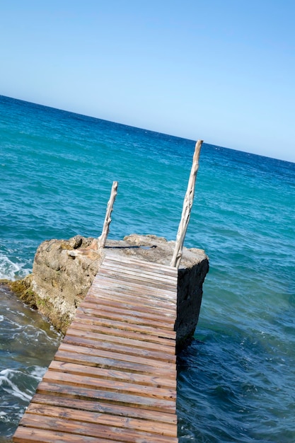 Pier at Hort Cove and Beach Ibiza Spain