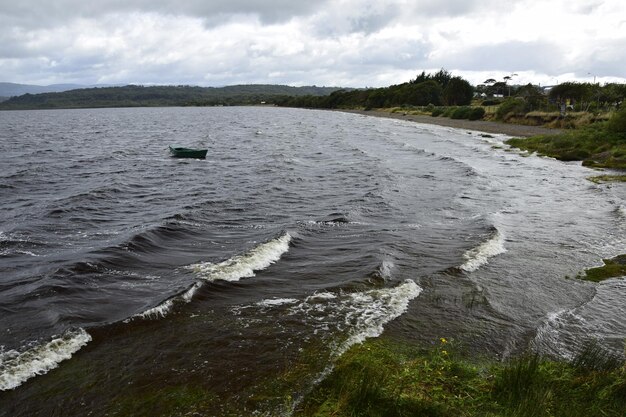 Pier over lake huillinco from which the naturalist charles\
darwin left on his journey through different lakes chile