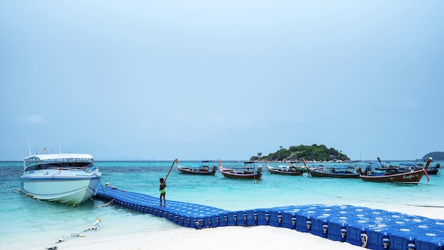 pier made of floating buoys in a tropical beach