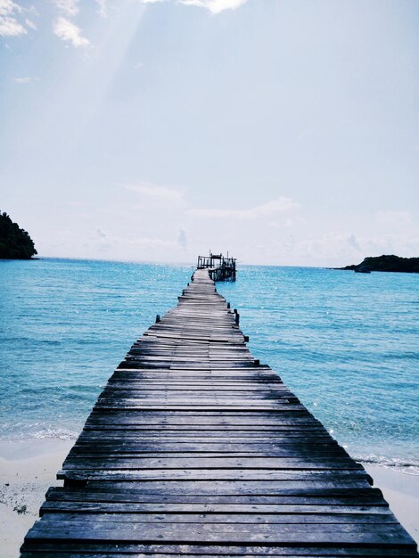 Pier over sea against sky