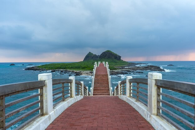 Pier over sea against sky