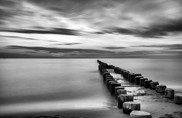 Pier over sea against sky