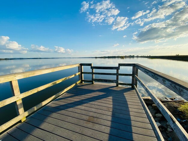 Pier over sea against sky