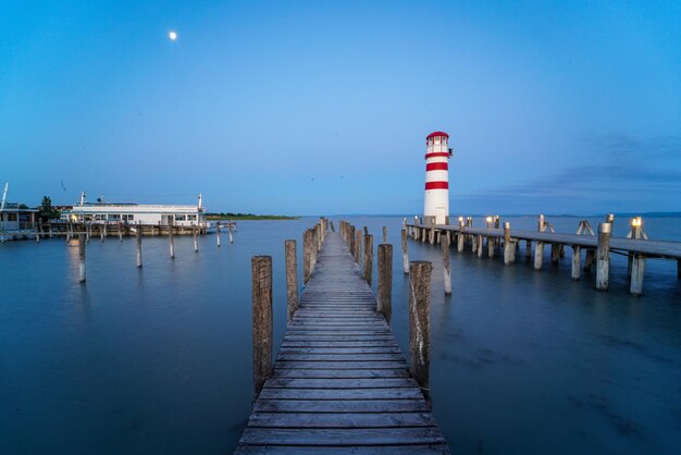 Pier over sea against sky