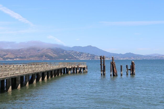 Pier over sea against sky