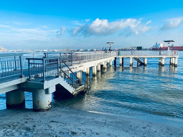 Pier over sea against sky