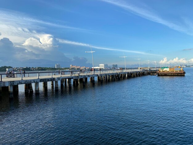 Pier over sea against sky