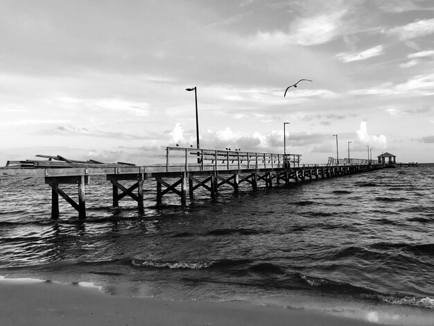 Pier over sea against sky