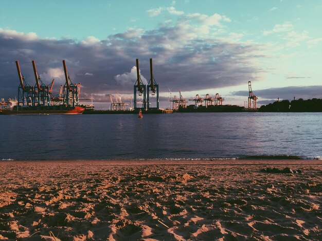 Pier on sea at sunset