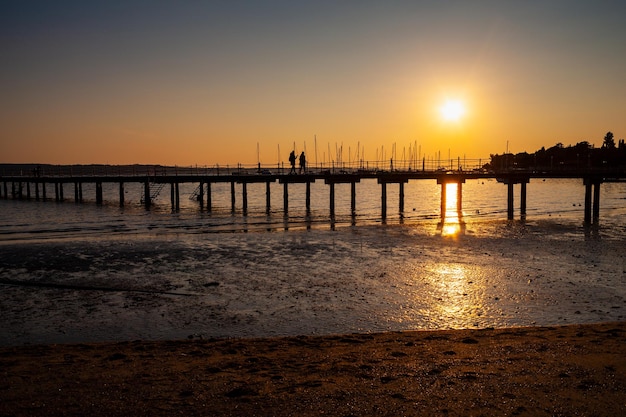 The pier at sundown Wooded bridge seaside with Sunset Strunjan Slovenia