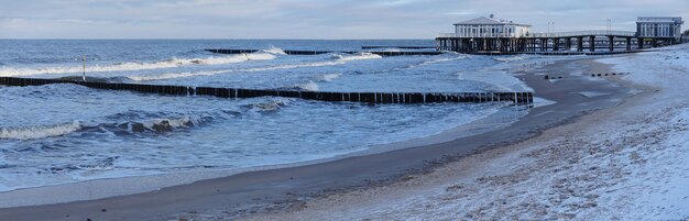 Pier in Ustronie Morskie Poland beach and groynes