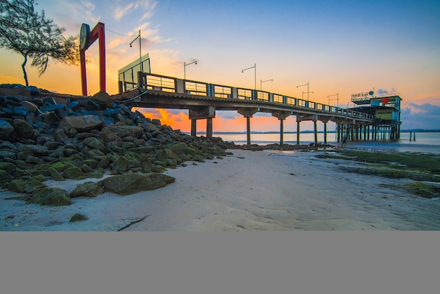 pier with beautiful sunrise on the beach batam island