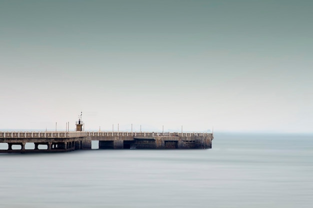 A pier with a blue sky in the background