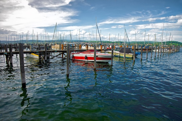 Pier with boats at Reichenau Island and Lake Constance in Baden-Wurttemberg in Germany.