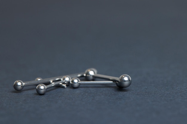 Piercing earrings closeup On a black background