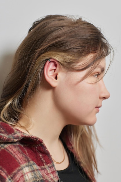 Piercings on an ear Conch and helix piercings close up