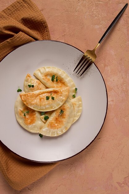 Pierogi a traditional dish of Polish cuisine dumplings top view closeup no people