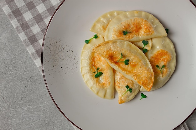 Pierogi a traditional dish of Polish cuisine dumplings top view closeup no people