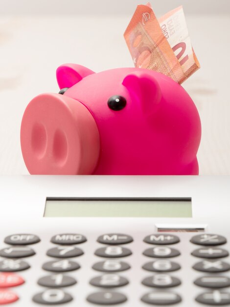 Piggy bank and calculator