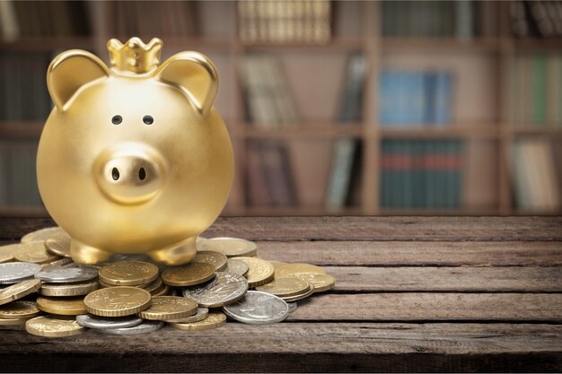 Piggy bank and coins on background