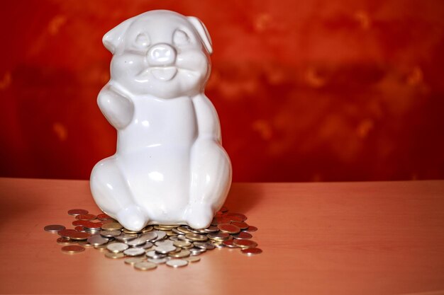 Photo piggy bank and coins on table