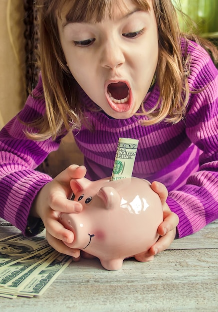 Piggy bank and dollars. Selective focus.