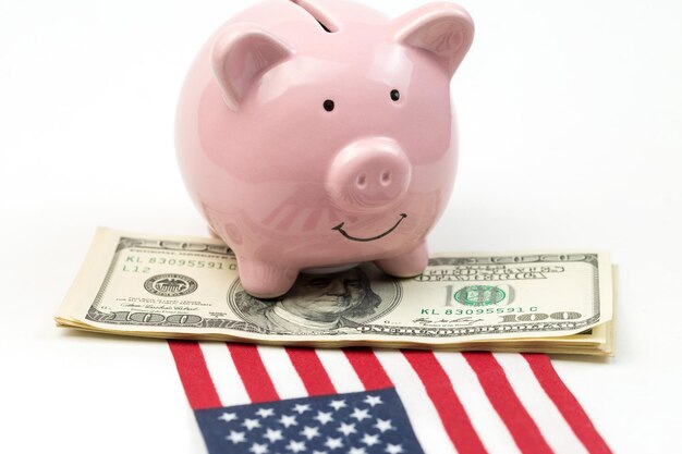 Piggy bank isolated against the background of the american flag. View from above.