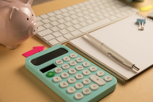 Photo piggy bank keyboard notepad and calculator