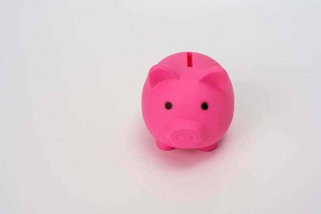 Piggy bank pink on a white background Symbol saving