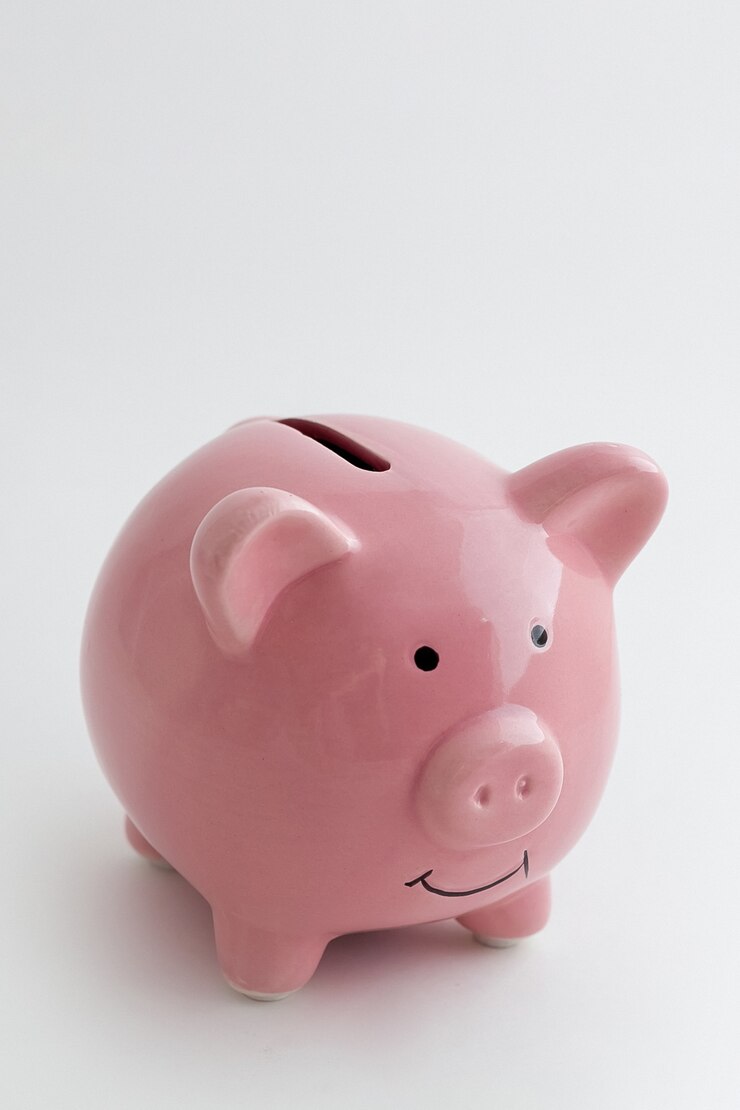 Photo piggy bank in the shape of a pig on an isolated white background