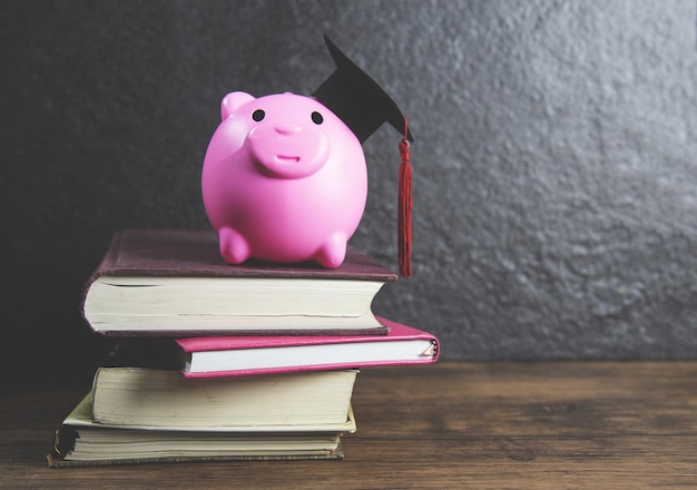 Photo piggy bank on stack of books