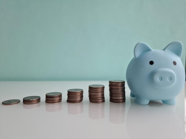 Piggy bank and stack of coins financial savings