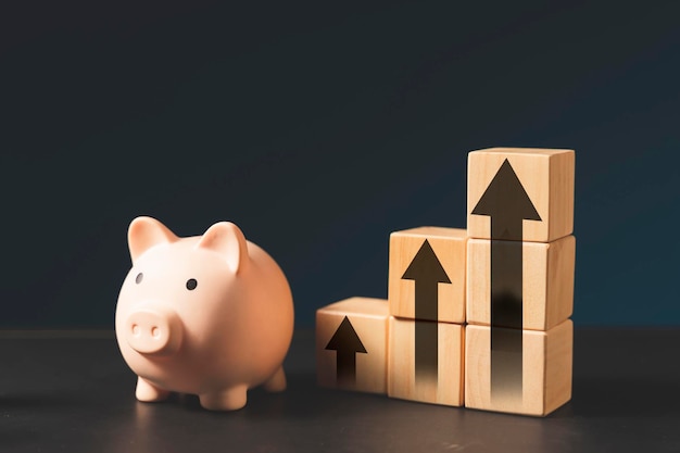 piggy bank and stacking wood blockmoney saving concept