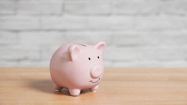 Piggy bank on table with copy space