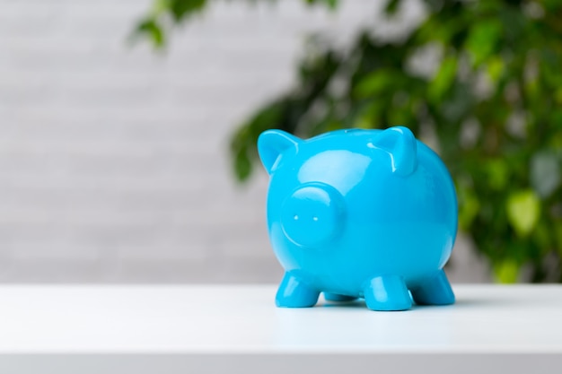 Piggy bank on table with copy space