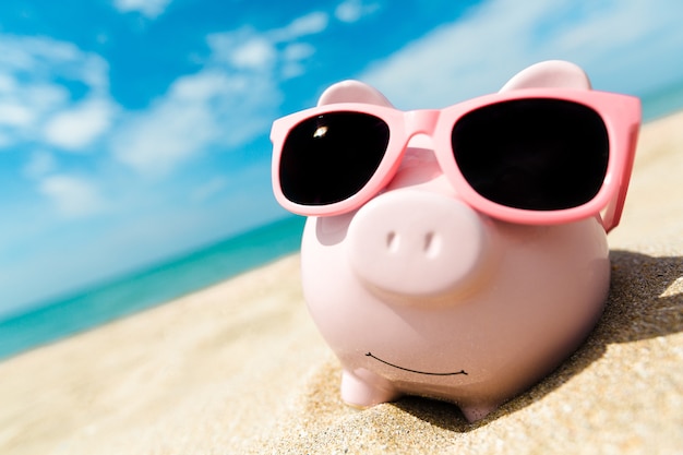 Piggy Bank Wearing Sunglasses Relaxing At The Beach