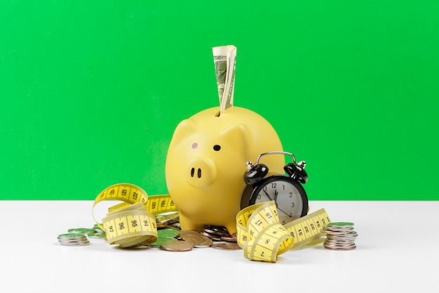 piggy bank with coin on the table