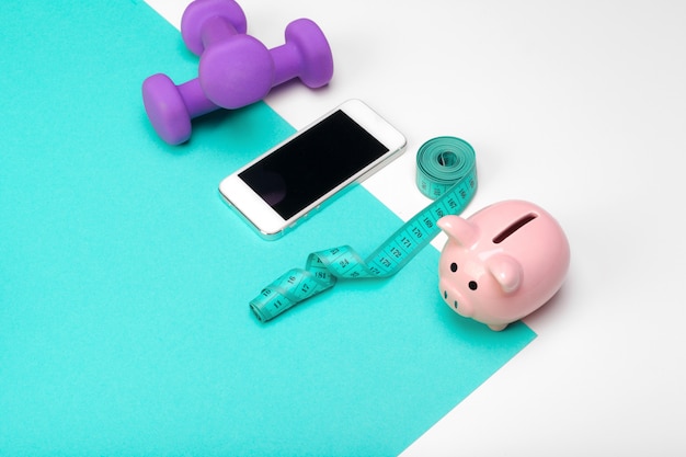 Photo piggy bank with dumbbells