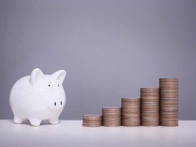 Photo piggy bank with stack of coins the concept of saving money financial investment and business growing