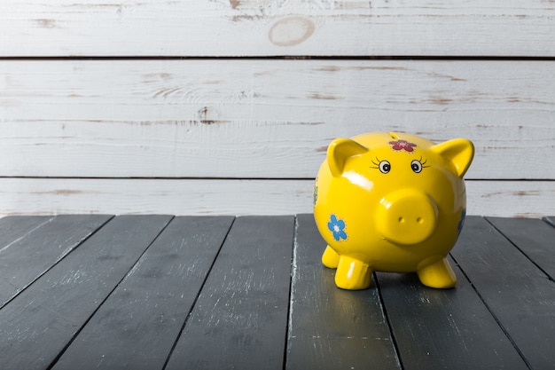 Photo piggy bank on wood table top