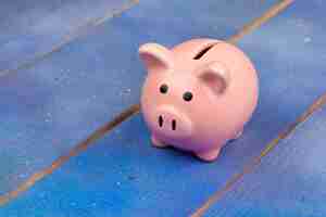 Photo piggy bank on wooden table