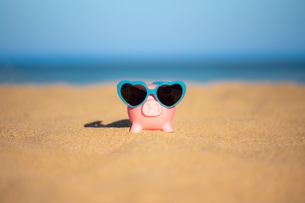 Piggybank on the beach in summer